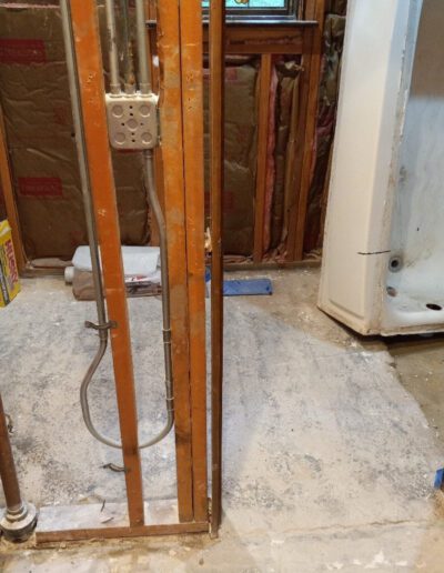 A bathroom being remodeled with a toilet and shower.