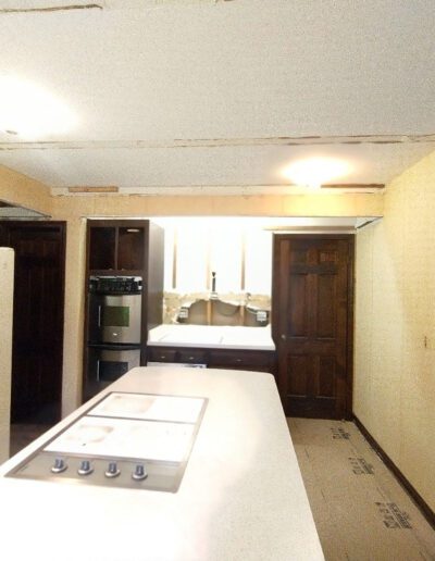 A kitchen with a white countertop.