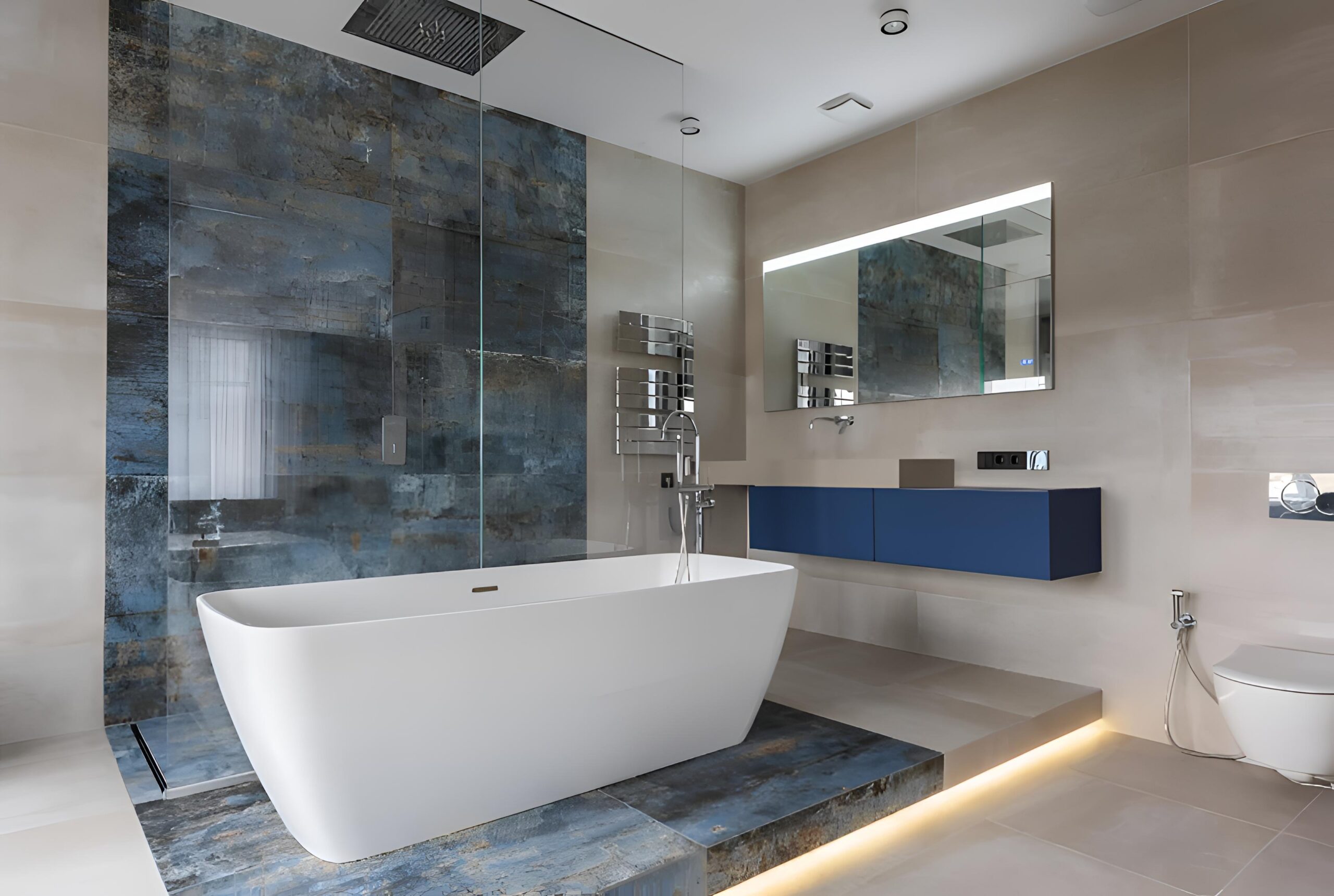 Modern bathroom with freestanding bathtub, glass-enclosed shower, large mirror, floating vanity with blue drawers, and beige tile walls.